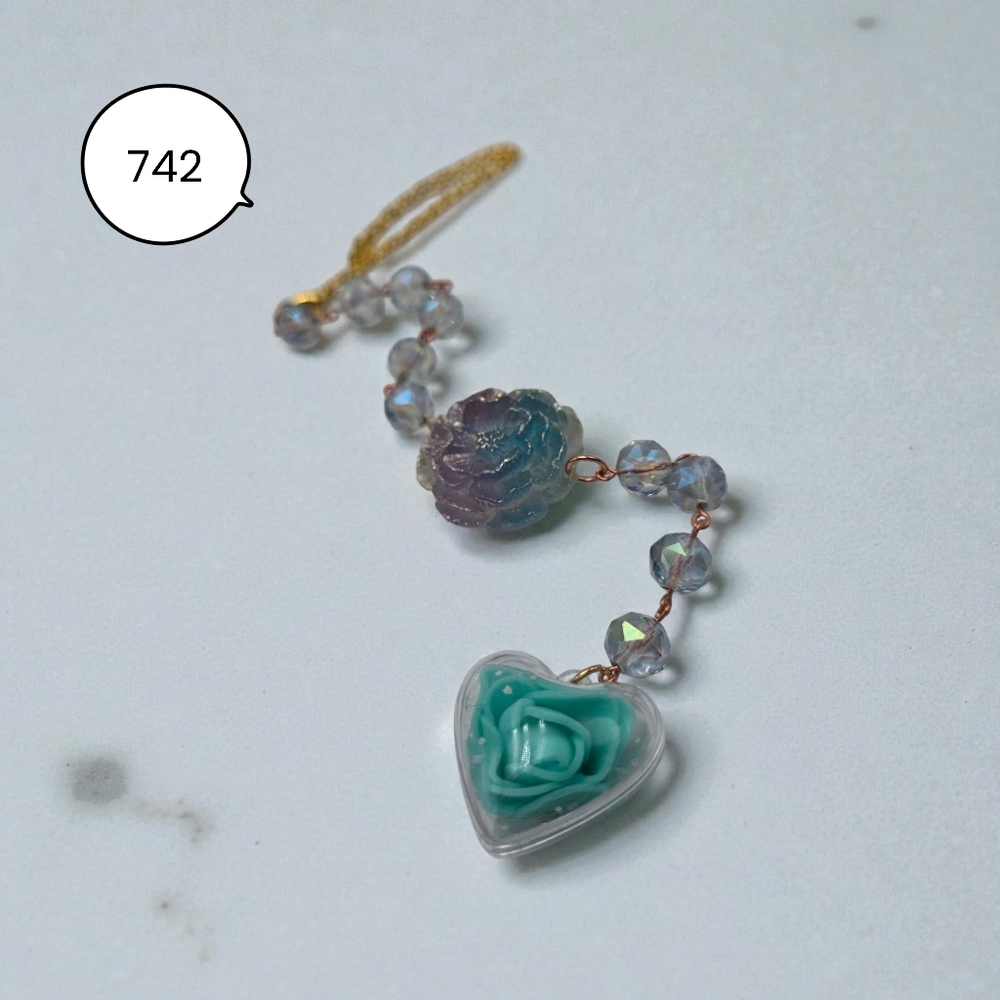 Handmade Irridescent Flower Car Charm with Teal Blue Heart Design.